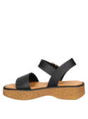 Sandalia de cuero negro con diseño robusto y elegante, perfecta para combinar con vestidos o jeans holgados.