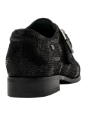 Zapato negro de cuero para mujer, estilo Oxford casual, con hebilla decorativa y punta ligeramente afilada.