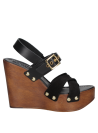 Sandalia de cuero negro con plataforma, perfecta para el verano.