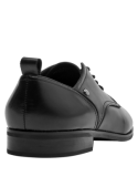 Calzado oxford de cuero negro para mujer, sofisticado y versátil, adecuado para reuniones de trabajo y cenas elegantes.