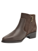 Botín de cuero marrón para mujer, estilo Chelsea, con elástico lateral, suela estable y puntera estilizada.