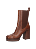 Bota de cuero café estilo Chelsea para mujer con taco grueso y suela robusta, ideal para uso diario y ocasiones formales.
