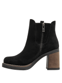 Clásico botín negro de cuero para mujer, estilo Chelsea, perfecto para looks casuales elegantes y ocasiones formales.