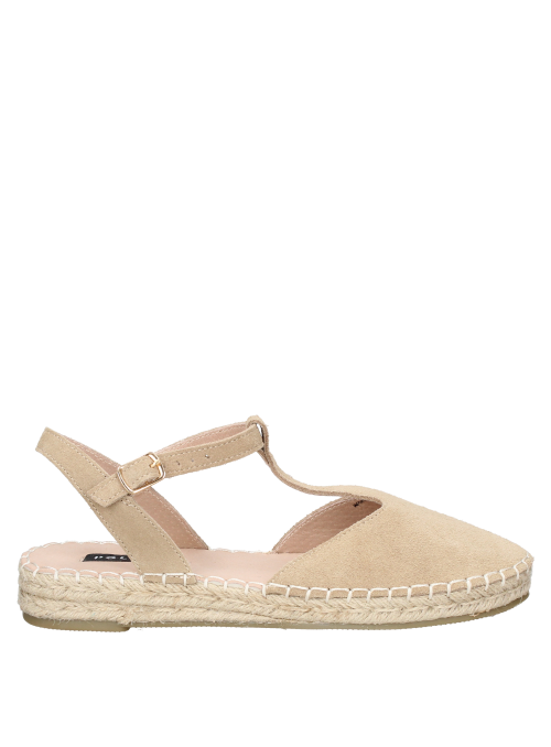Suela artesanal de esparto en alpargata beige de cuero, combinable con faldas midi.