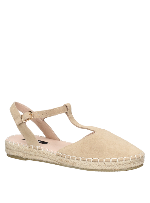 Suela artesanal de esparto en alpargata beige de cuero, combinable con faldas midi.
