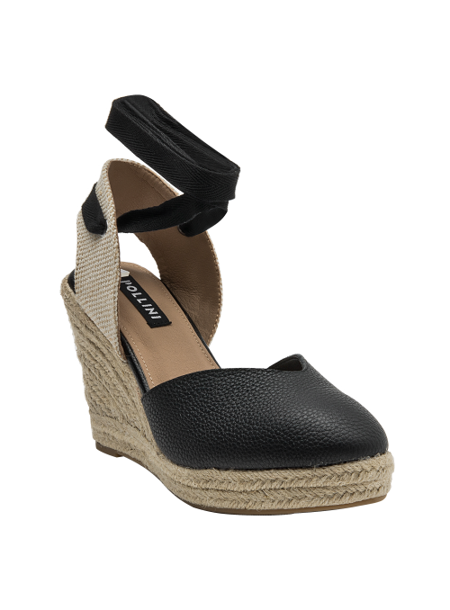 Alpargata casual de cuero negro, perfecta para salidas informales y eventos al aire libre.