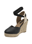 Alpargata de cuero negro para mujer con plataforma de yute y cintas al tobillo.
