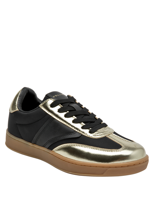 silueta moderna de zapatilla negra con acentos dorados brillantes y suela color caramelo
