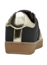 zapatilla deportiva de mujer en textil negro con detalles dorados elegantes y suela caramelo