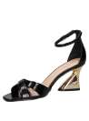 Calzado minimalista de fiesta en cuero negro, ideal para eventos nocturnos.