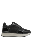 zapatilla de cuero negro con líneas limpias y estilo urbano