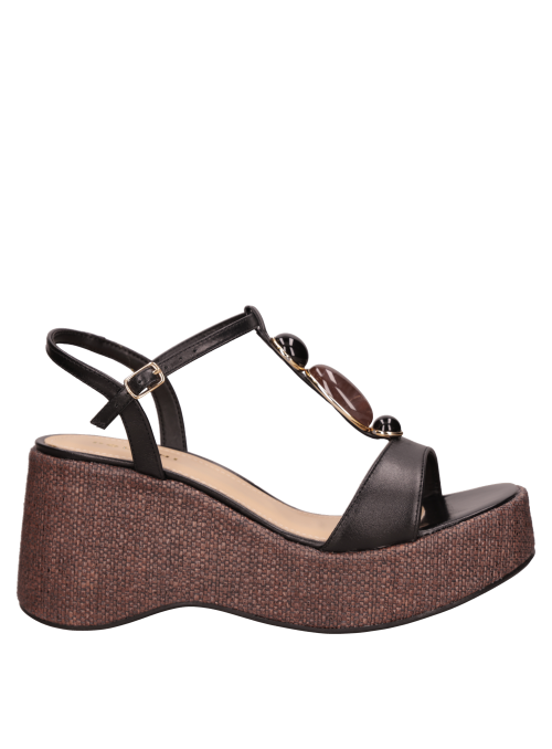 Cuña negra de cuero para mujer, perfecta para looks de día y noche.