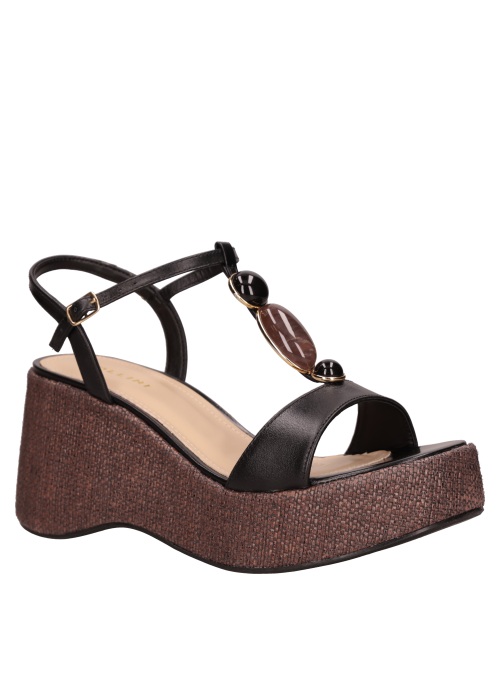 Cuña negra de cuero para mujer, perfecta para looks de día y noche.