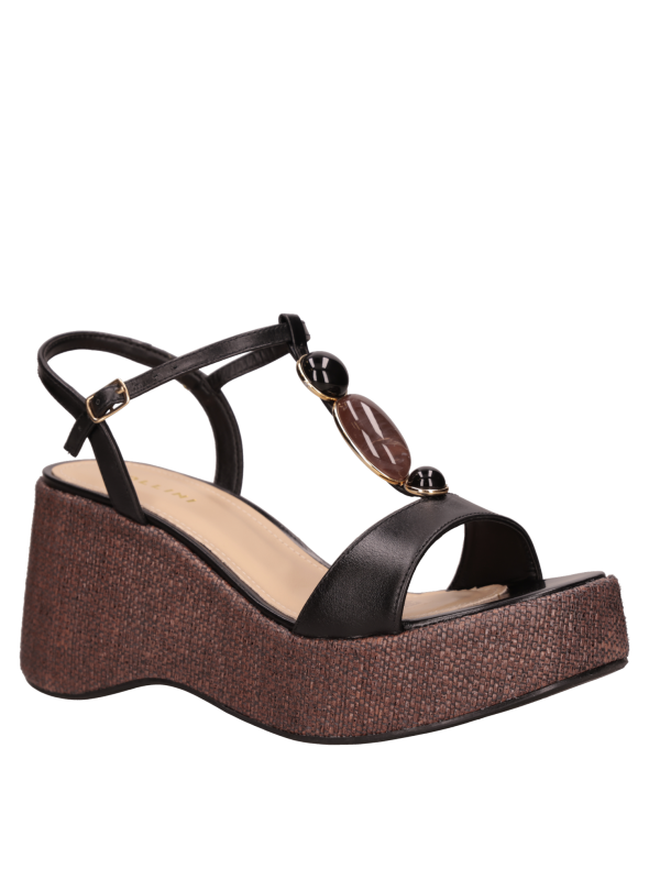 Cuña negra de cuero para mujer, perfecta para looks de día y noche.