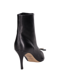 Botín negro de cuero para mujer, diseño vanguardista, perfecto con vestidos ajustados.