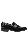 mocasín negro mujer ideal para combinar con vestido midi y jeans ajustados en eventos casuales