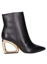 Botines de cuero negro para mujer, diseño contemporáneo, recomendado para salir de noche.