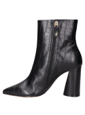 Botín negro de cuero para mujer, con acabado brillante, perfecto para salidas nocturnas.