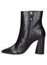 Botín negro de cuero para mujer, con acabado brillante, perfecto para salidas nocturnas.