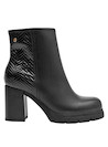 Botín negro de cuero, diseño elegante y cómodo, perfecto para combinar con vestidos o jeans.