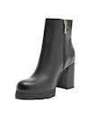 Botín negro de cuero para mujer, altura de 7.5 cm, ideal para un look sofisticado y moderno.
