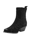 Botín de mujer en cuero negro, con textura suave que evoca sofisticación y tendencia.