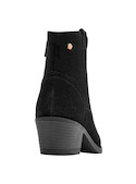 Botín negro de mujer, diseño contemporáneo en cuero, ideal para looks vanguardistas y sofisticados.