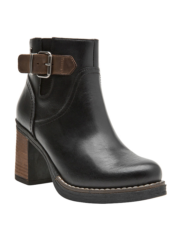Botín negro de cuero con tacón bloque, perfecto para un look equilibrado con jeans y blusas de seda.