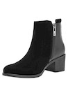 Botín negro de mujer en cuero suave, estilo casual, ideal para looks urbanos y elegantes.