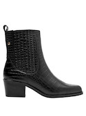 Botín casual de mujer en cuero negro, perfecto para un estilo empoderado y seguro.