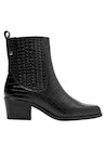 Botín casual de mujer en cuero negro, perfecto para un estilo empoderado y seguro.