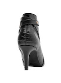 Botín sofisticado negro de cuero para mujer, perfecto para combinar con vestidos ajustados o pantalones de cuero.