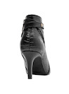 Botín sofisticado negro de cuero para mujer, perfecto para combinar con vestidos ajustados o pantalones de cuero.