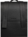 Mochila negra de mujer estilo casual con acabado en PU graneado, ideal para actividades diarias.
